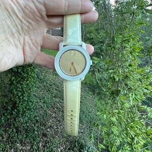 Movado Ladies Wristwatch Gold Stardust Dial Ivory Strap Swiss Quartz AUTHENTIC